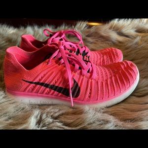 Neon pink Nike free runs